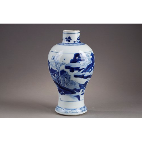 white blue porcelain baluster shaped vase has decor on each side of a mountain landscape scene
China Kangxi period 1662/1722